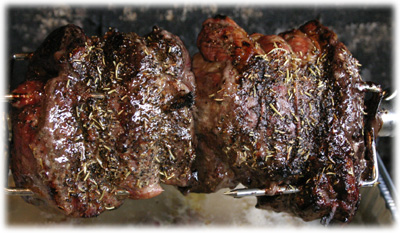 rotisserie cooking beef on a gas grill