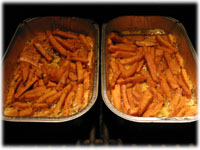 sweet potato fries in a pan on the grill