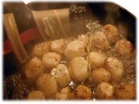 pouring Drambuie on scallops